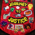 A red sewn banner with the words ''Journey to Justice'
